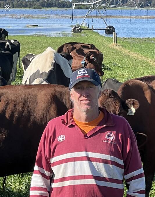 South Coast dairy farmer Tim Cochrane with water logged paddocks. Picture supplied.