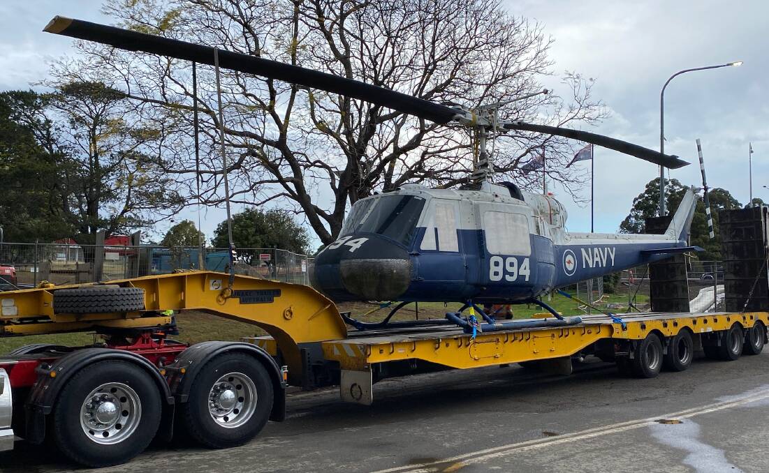The Iroquois helicopter that has been a notable Nowra landmark for 25 years was removed from its pole last week and taken away for refurbishment. Picture by Glenn Ellard.