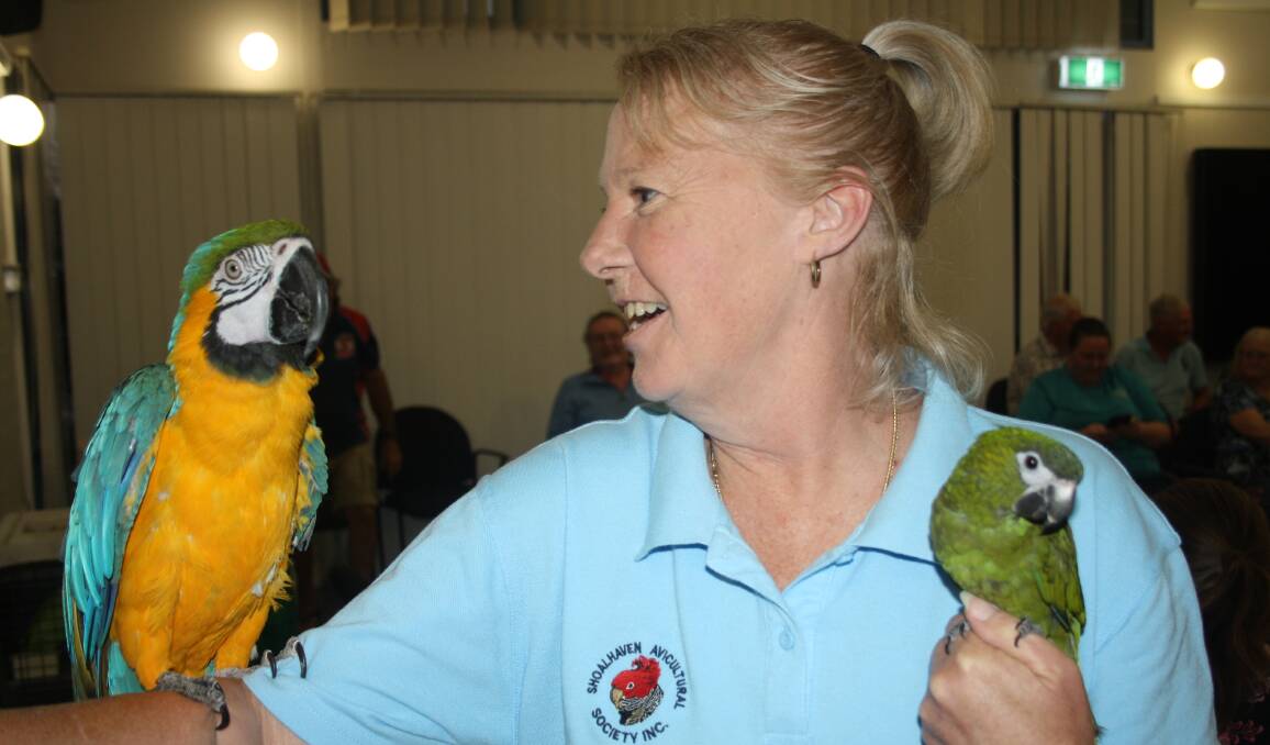 Debbie Brincat displays some of the bird varieties on offer during the annual Shoalhaven Avicultural Society bird sale at Shoalhaven High School. Picture by Glenn Ellard.