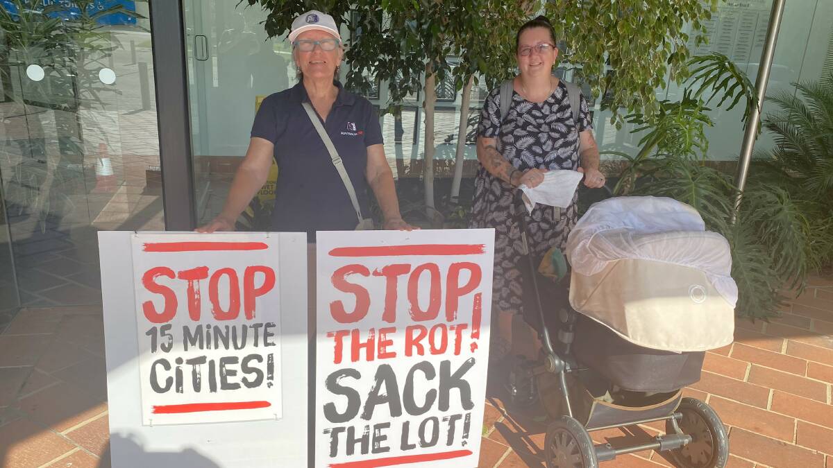 Yvonne Rozer and Jakki Haydock make their feelings obvious outside the Shoalhaven City Council meeting on Monday, January 29. Picture by Glenn Ellard.