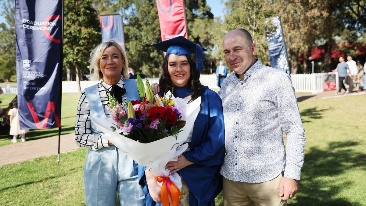 Marina Crnalic with parents at the UOW spring graduations at UOW Sports Hub on October 31, 2023. Picture by Sylvia Liber.