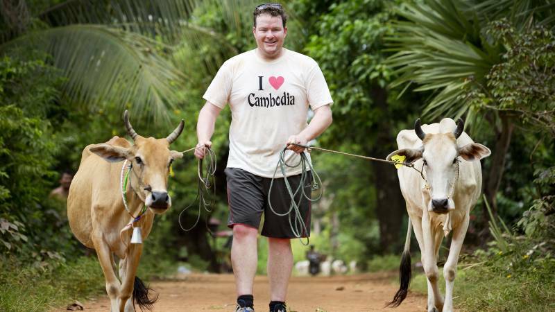  Cows for Cambodia founder Andrew Costello with two of the breeders in the charity. PHOTO: Cows for Cambodia.
