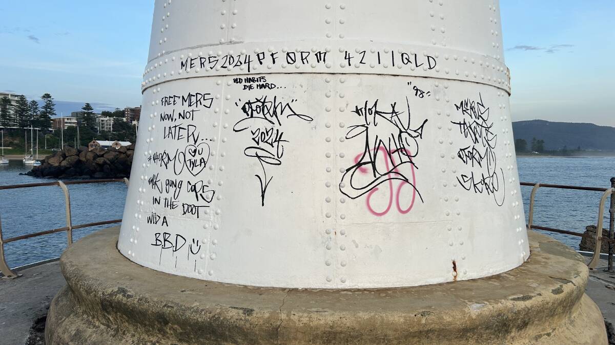 Large graffiti has been scrawled on Wollongong's breakwater lighthouse in the harbour. Picture by Nadine Morton 