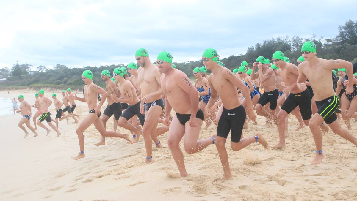READY SET GO: Eager starters at the 2022 Mollymook Beach annual fund raising Ocean Swim. Photo: KEN BANKS
